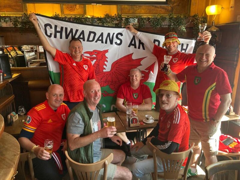 welsh football team fans on tour with bucket hats